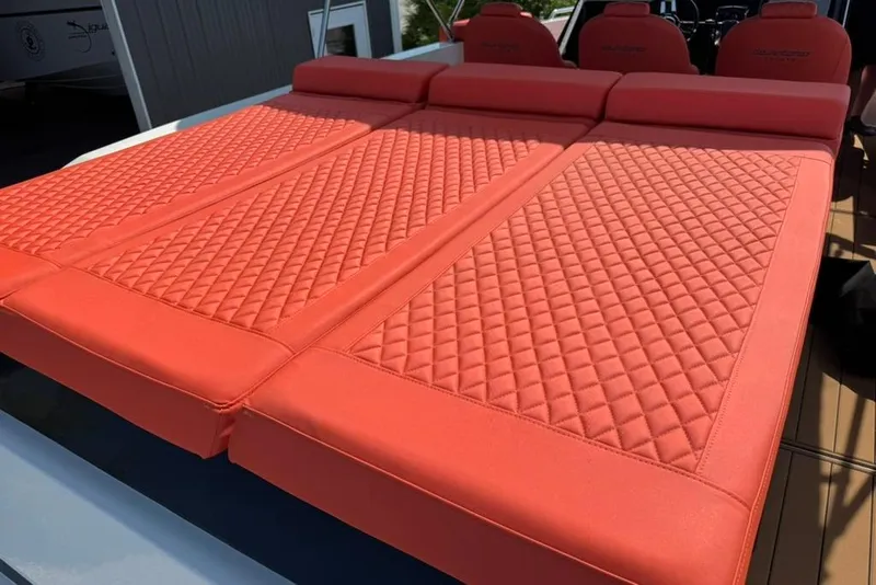 Slide: The Image of Red quilted seating on 2020 De Antonio Yachts D28, showcasing luxury and comfort. - 63