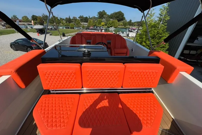 Slide: The Image of 2020 De Antonio Yachts D28 with vibrant orange seating and sleek design. - 69