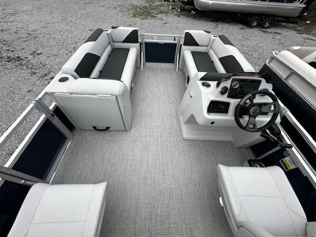 Slide: The Image of 2024 Tahoe Pontoon SPORT 2180 QL interior with spacious seating and modern helm. - 2