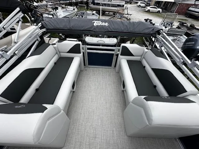 Slide: The Image of 2024 Tahoe Pontoon SPORT 2180 QL interior with spacious seating and canopy. - 4