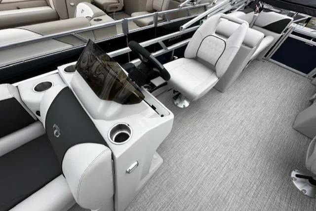 Slide: The Image of 2024 Tahoe Pontoon SPORT 2180 QL interior with helm, seating, and modern design. - 8