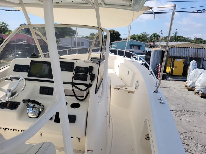 Slide: The Image of 2002 Pursuit 3070 Center Console boat with modern navigation equipment. - 10
