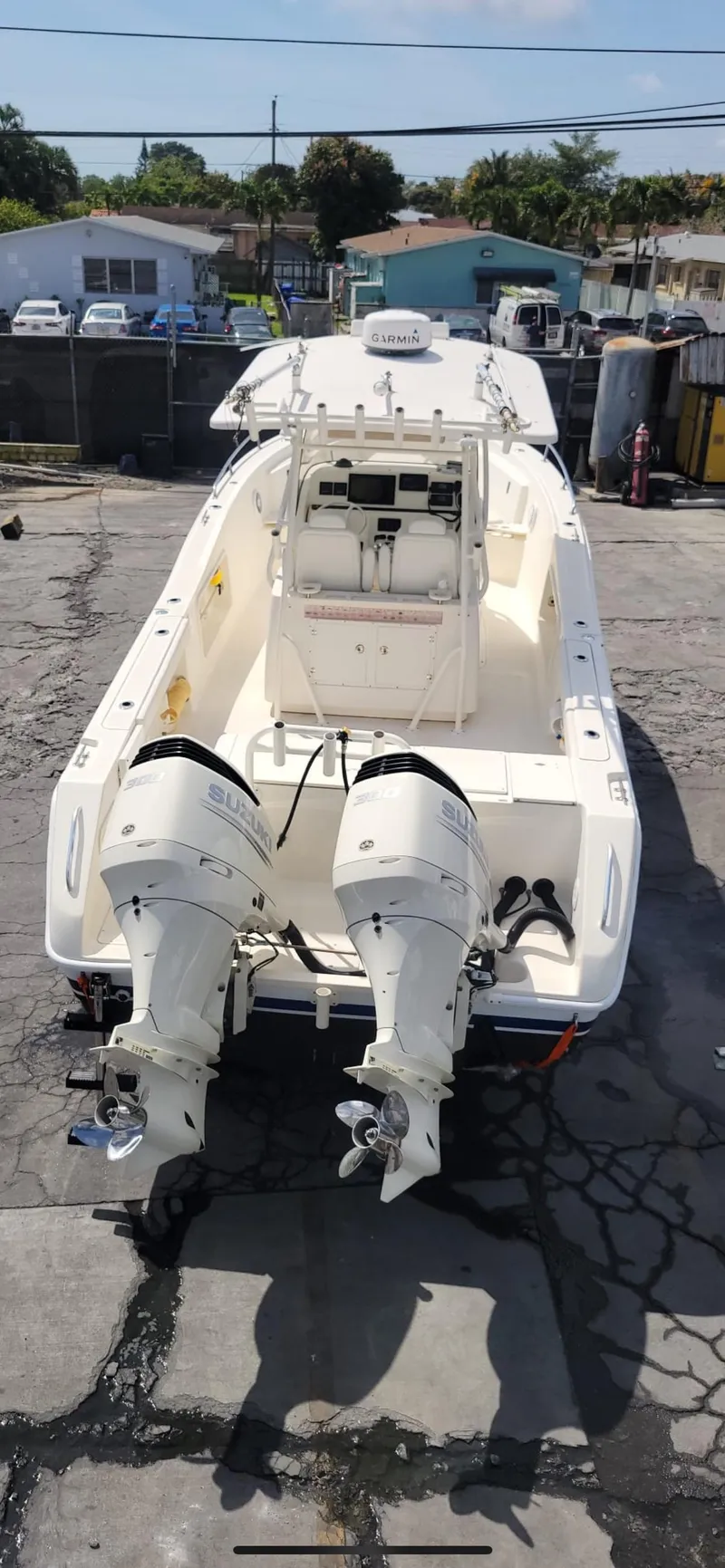 Slide: The Image of 2002 Pursuit 3070 Center Console boat with twin outboard engines. - 15