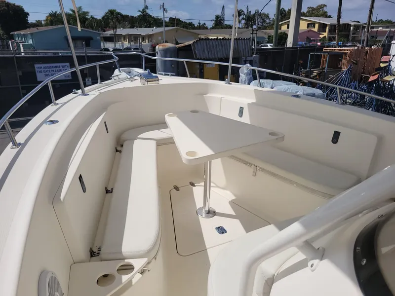 Slide: The Image of 2002 Pursuit 3070 Center Console boat with spacious seating and table. - 5
