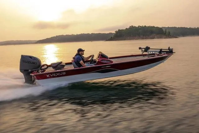 Slide: The Image of 2024 Vexus AVX1880C boat speeding on a lake at sunset. - 1