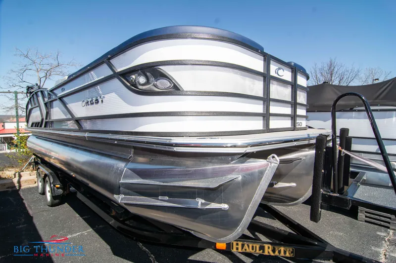 Slide: The Image of 2023 Crest Caribbean LX 250 SLC pontoon boat on a Haul Rite trailer. - 0
