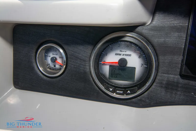 Slide: The Image of 2023 Crest Caribbean LX 250 SLC dashboard with RPM and fuel gauges. - 15