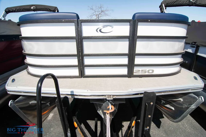 Slide: The Image of 2023 Crest Caribbean LX 250 SLC pontoon boat rear view. - 2