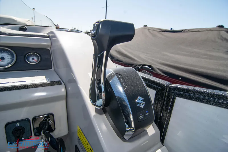Slide: The Image of Close-up of the control panel and throttle of a 2023 Crest Caribbean LX 250 SLC boat. - 20