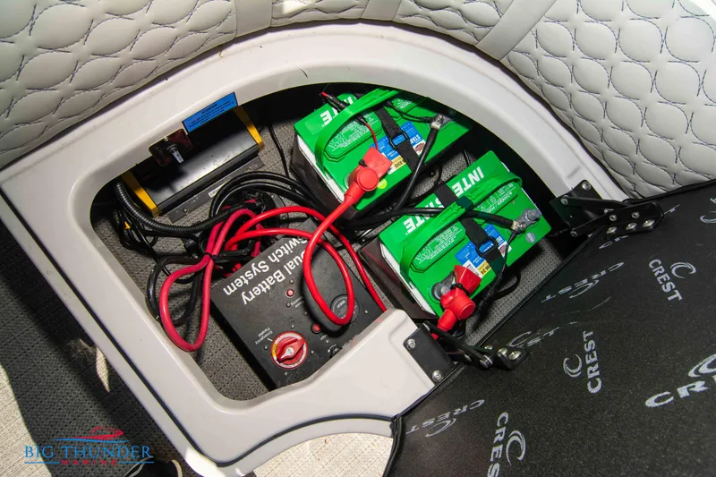 Slide: The Image of Battery compartment of 2023 Crest Caribbean LX 250 SLC boat with wiring and battery system. - 30