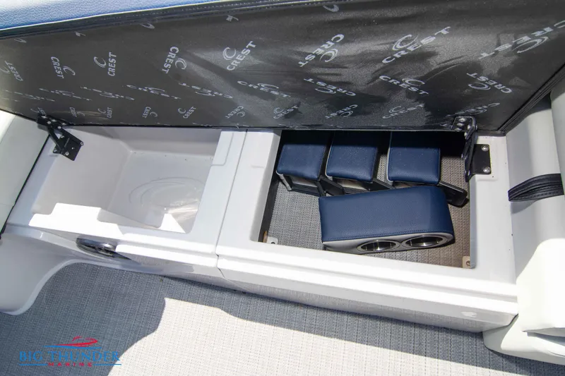 Slide: The Image of 2023 Crest Caribbean LX 250 SLC storage compartment with cup holders. - 33
