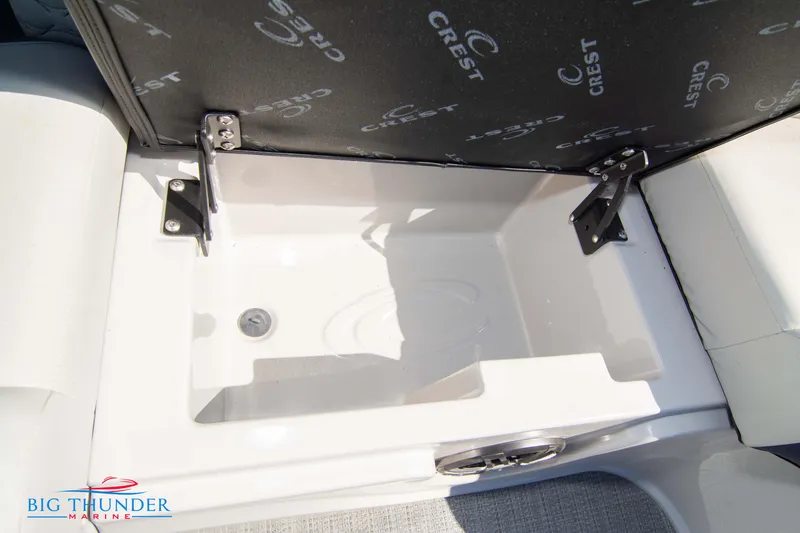 Slide: The Image of Storage compartment in 2023 Crest Caribbean LX 250 SLC boat. - 34