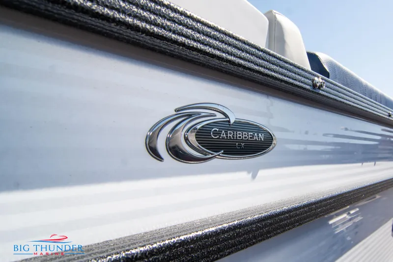 Slide: The Image of 2023 Crest Caribbean LX 250 SLC boat side view with logo. - 4