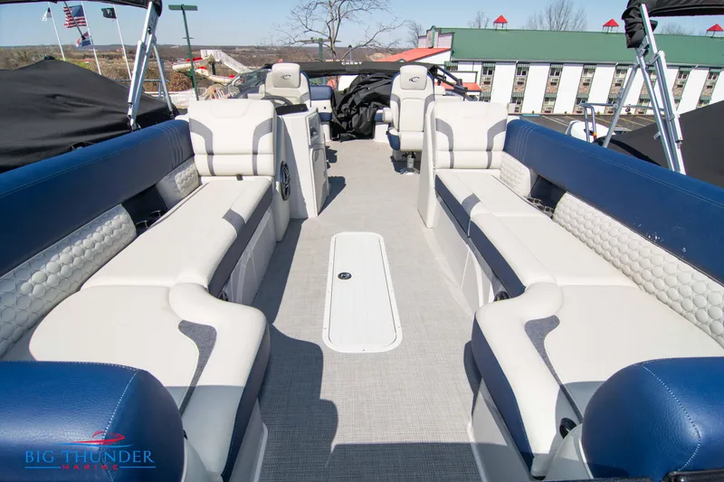 Slide: The Image of 2023 Crest Caribbean LX 250 SLC pontoon boat interior with luxurious seating. - 5