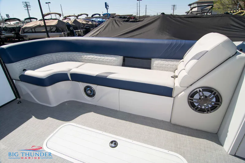 Slide: The Image of 2023 Crest Caribbean LX 250 SLC boat interior with luxurious seating and built-in speakers. - 7
