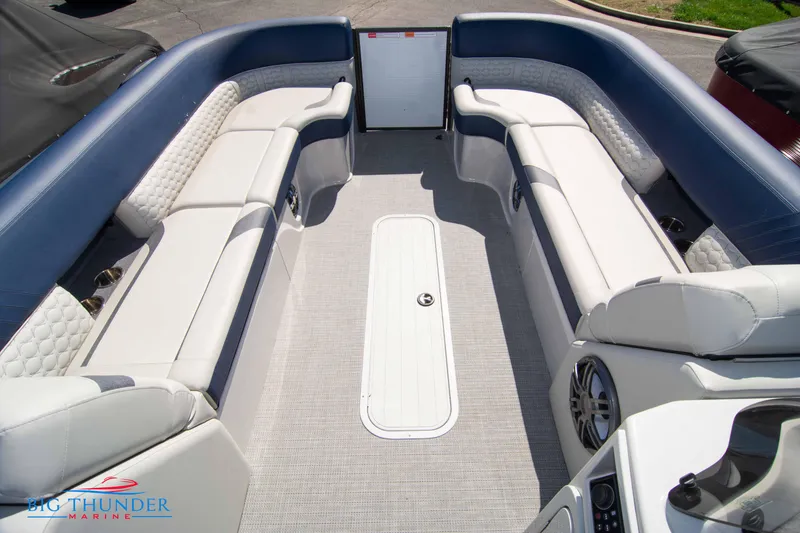 Slide: The Image of 2023 Crest Caribbean LX 250 SLC boat interior with spacious seating and modern design. - 8