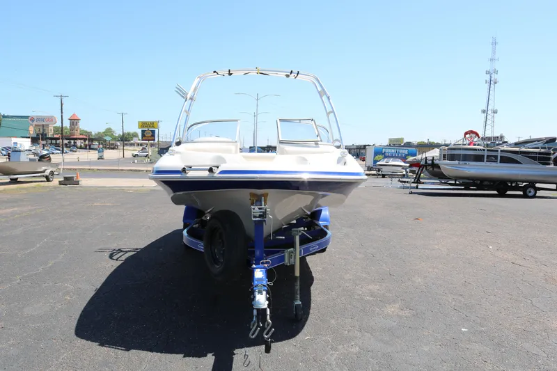 Slide: The Image of 2007 Tahoe Q6 SF boat on trailer in parking lot. - 2