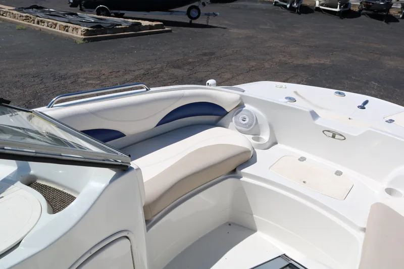 Slide: The Image of 2007 Tahoe Q6 SF boat interior with white and blue seating. - 21