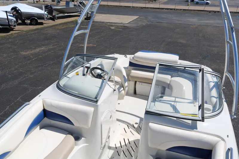Slide: The Image of 2007 Tahoe Q6 SF boat interior with seating and steering wheel. - 24