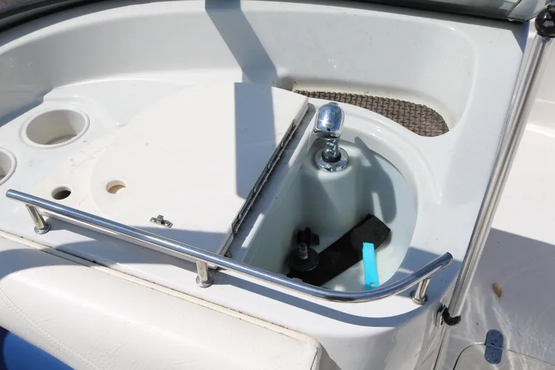 Slide: The Image of 2007 Tahoe Q6 SF boat interior with cup holders and storage compartment. - 35