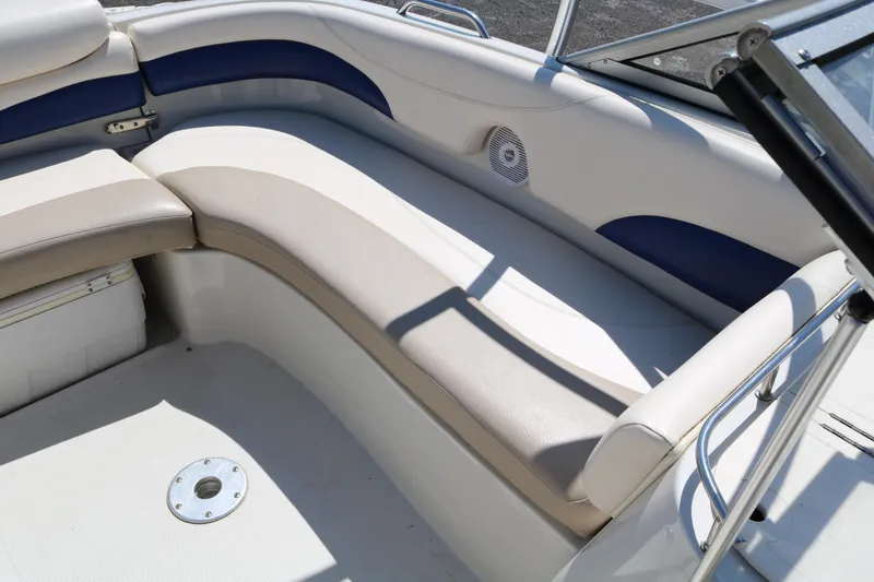 Slide: The Image of 2007 Tahoe Q6 SF boat interior with beige and blue seating. - 37