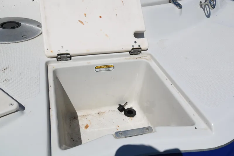 Slide: The Image of Open storage compartment on a 2007 Tahoe Q6 SF boat. - 48