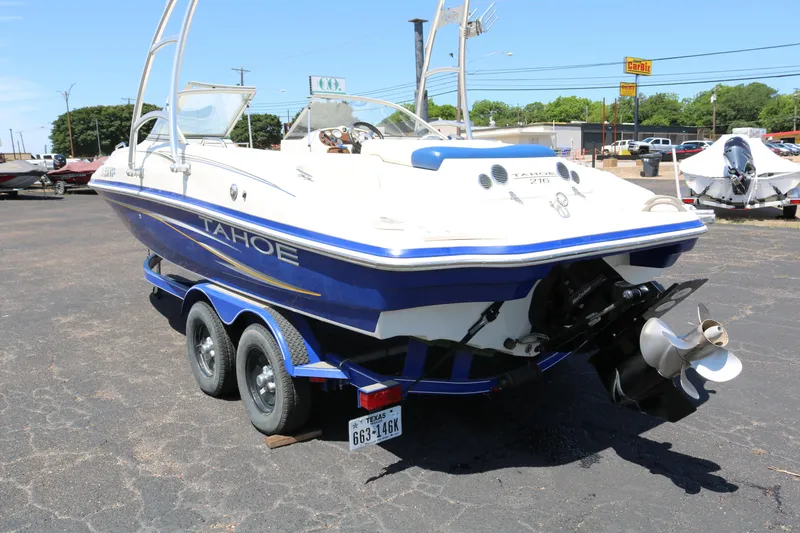 Slide: The Image of 2007 Tahoe Q6 SF boat on a trailer in a parking lot. - 8