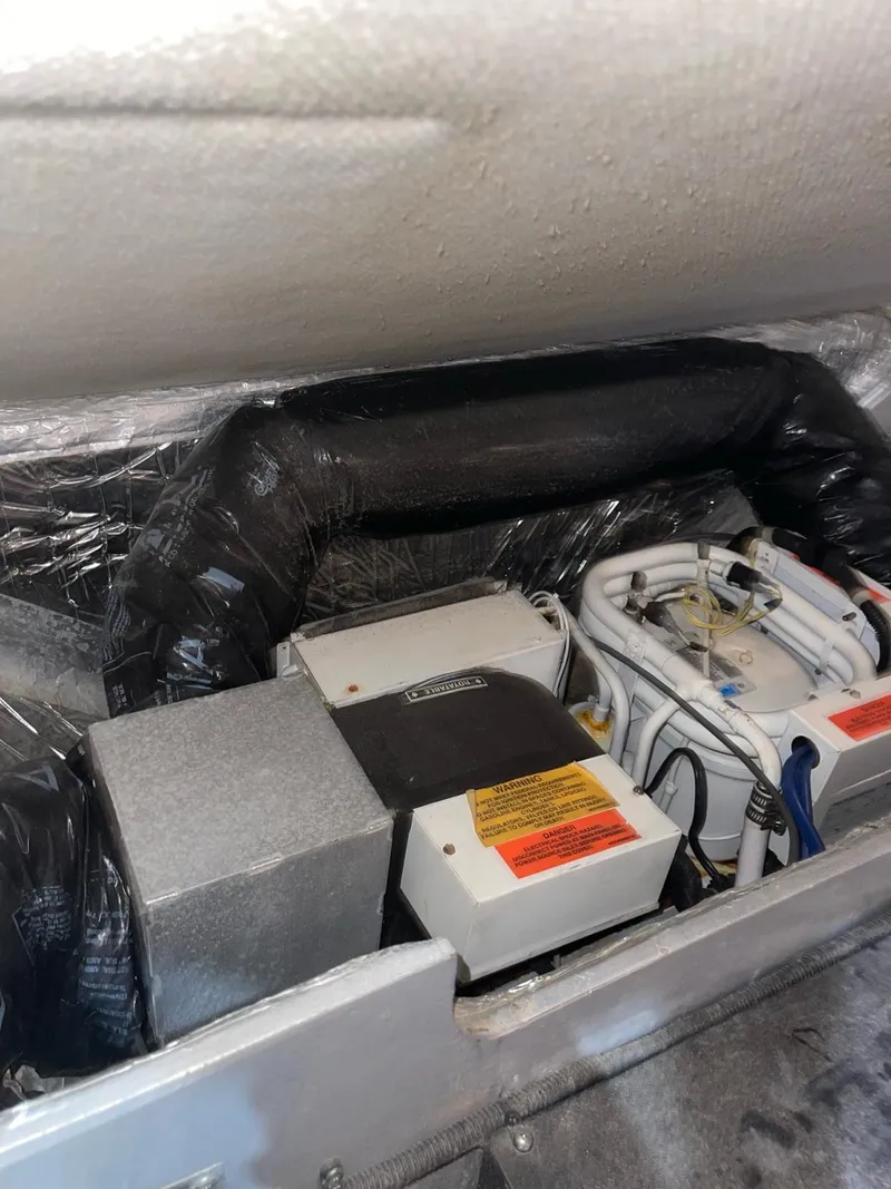 Slide: The Image of Engine compartment of a 2000 Sea Ray 450 Express Bridge boat. - 11