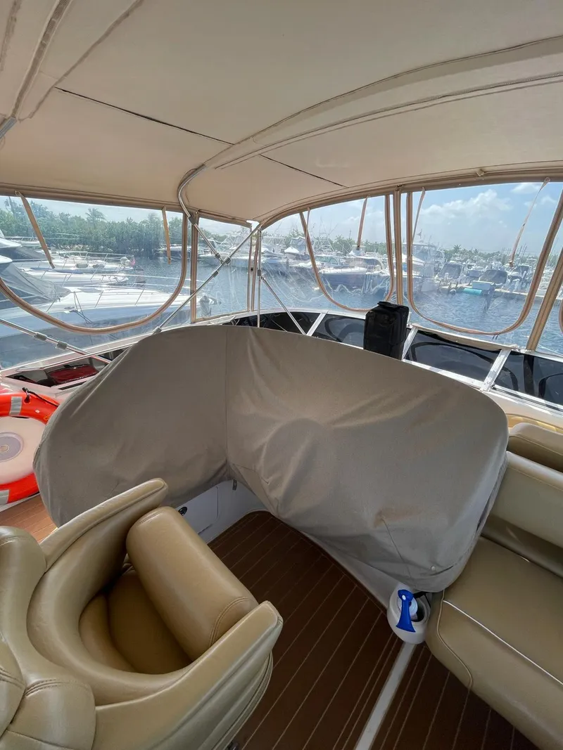 Slide: The Image of Interior view of 2000 Sea Ray 450 Express Bridge yacht with tan seating. - 4