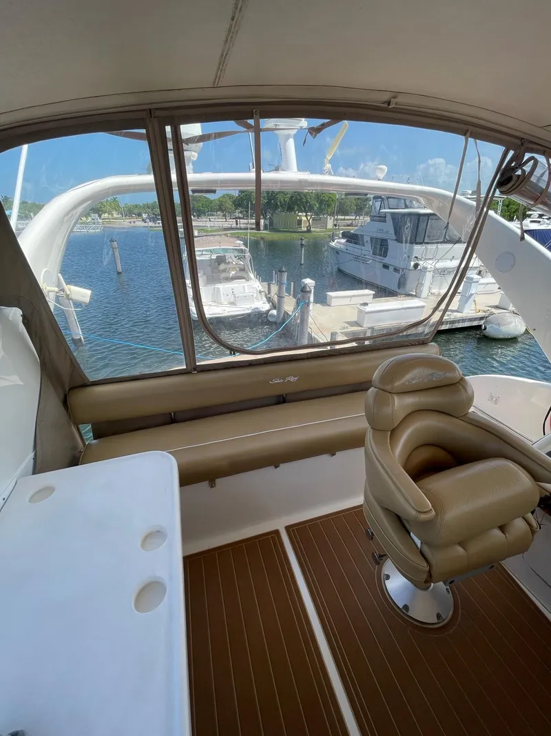 Slide: The Image of 2000 Sea Ray 450 Express Bridge interior view at marina. - 6