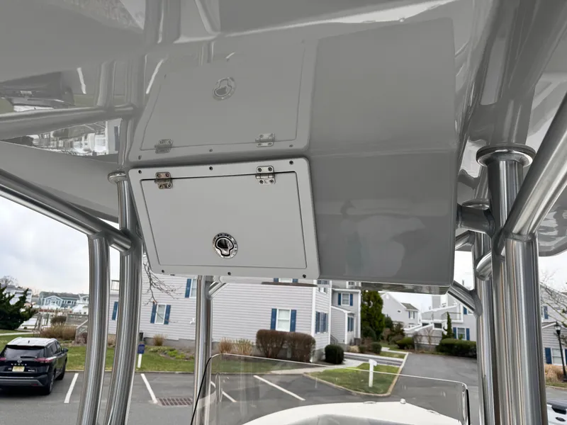 Slide: The Image of 2024 KenCraft 21 Center Console boat with overhead storage compartment. - 12