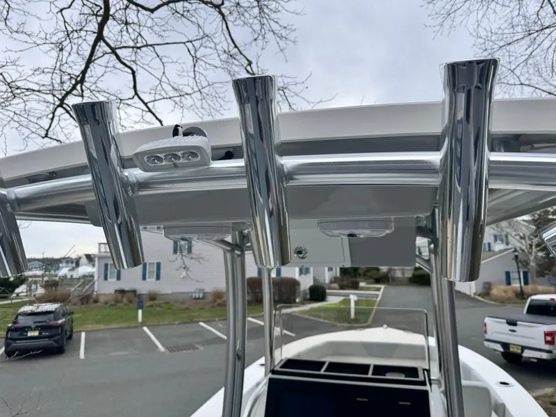 Slide: The Image of 2024 KenCraft 21 Center Console boat with T-top rod holders. - 13