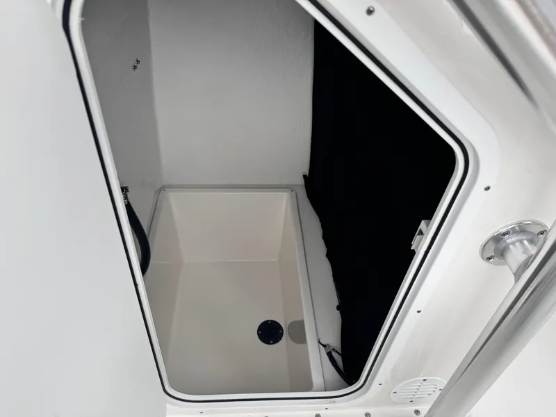 Slide: The Image of 2024 KenCraft 21 Center Console storage compartment interior. - 14