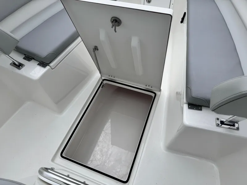 Slide: The Image of 2024 KenCraft 21 Center Console boat with open storage compartment. - 18