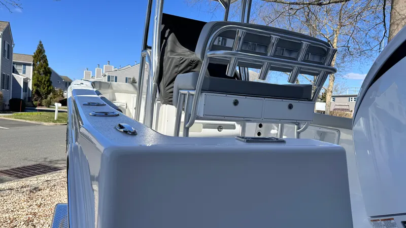 Slide: The Image of 2024 KenCraft 21 Center Console boat in a residential area. - 2