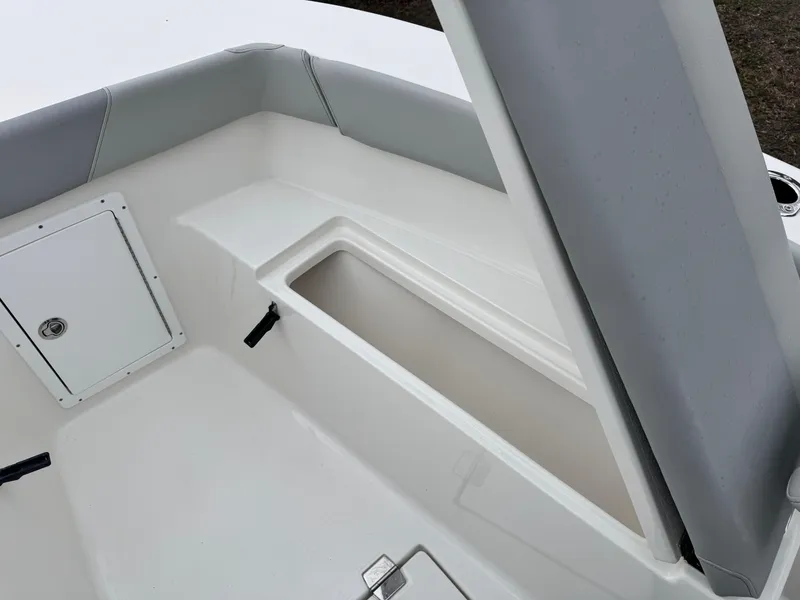 Slide: The Image of 2024 KenCraft 21 Center Console boat interior storage compartment and seating area. - 20