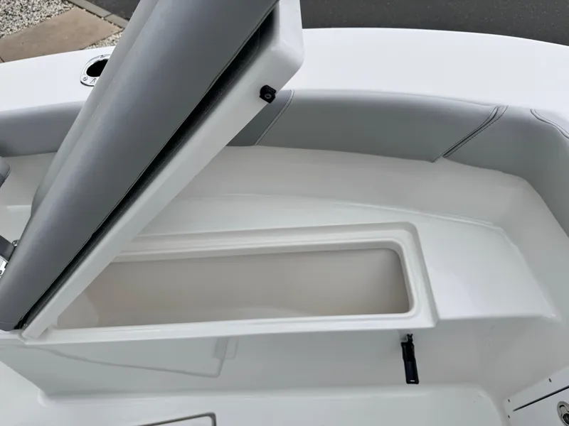 Slide: The Image of 2024 KenCraft 21 Center Console boat with open storage compartment. - 21