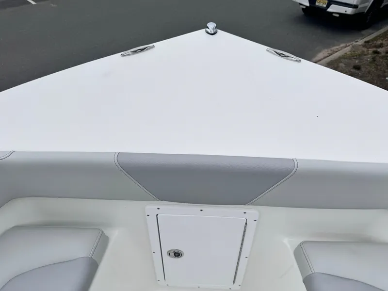 Slide: The Image of 2024 KenCraft 21 Center Console boat bow with storage compartment. - 22