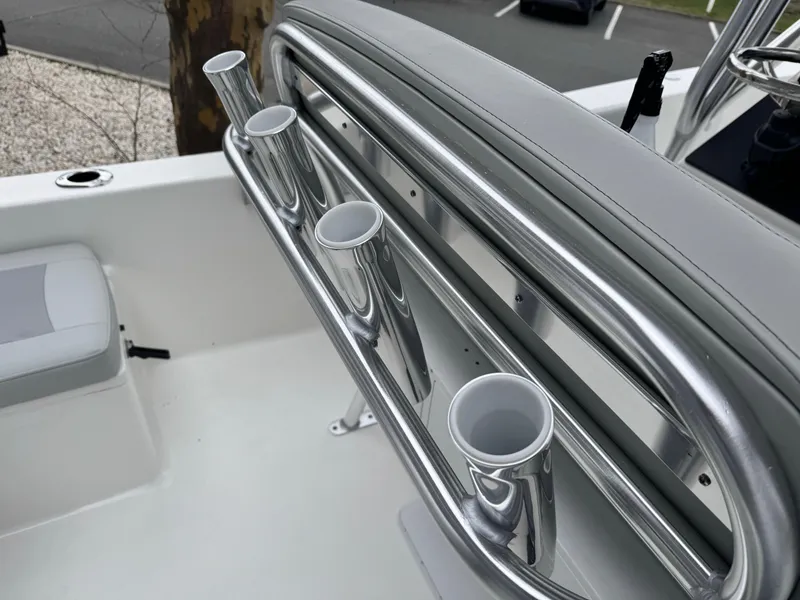 Slide: The Image of 2024 KenCraft 21 Center Console boat with stainless steel rod holders. - 5