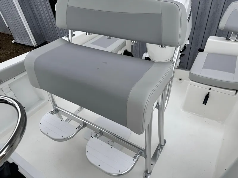 Slide: The Image of 2024 KenCraft 21 Center Console boat seating and console area. - 7