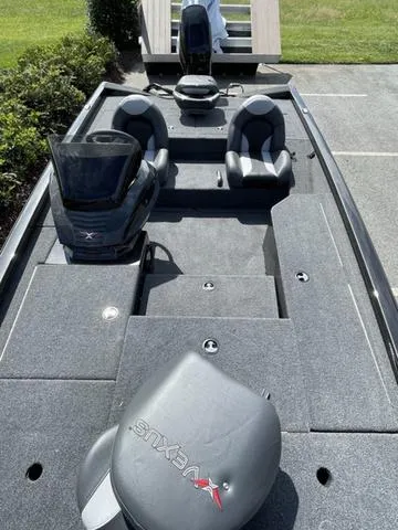 Slide: The Image of 2023 Vexus AVX181 fishing boat with dual seats and modern dashboard. - 11