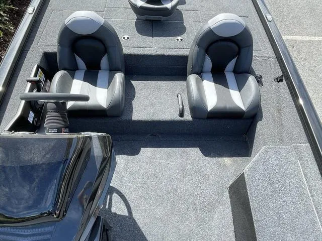 Slide: The Image of 2023 Vexus AVX181 boat interior with dual seats and steering console. - 13