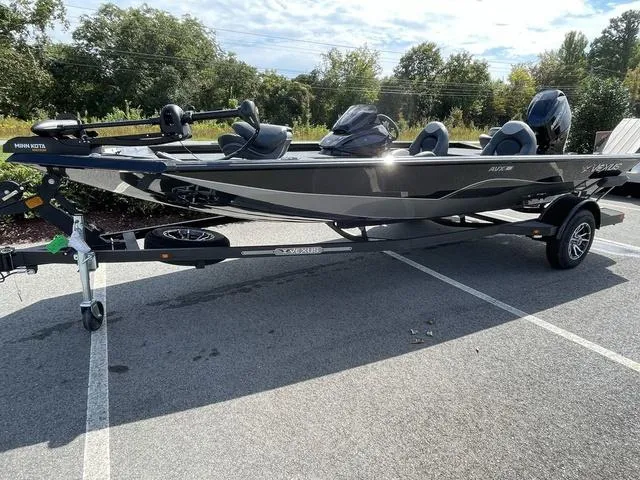 Slide: The Image of 2023 Vexus AVX181 boat on a trailer in a parking lot. - 3