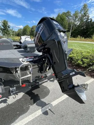 Slide: The Image of 2023 Vexus AVX181 boat with Mercury outboard motor in a parking lot. - 4