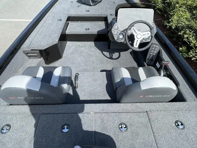 Slide: The Image of 2023 Vexus AVX181 boat interior with dual seats and steering console. - 6