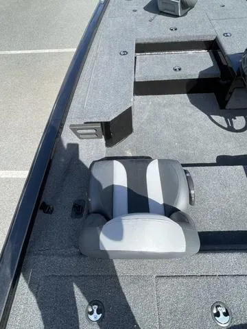 Slide: The Image of 2023 Vexus AVX181 boat interior with gray seating and deck. - 8
