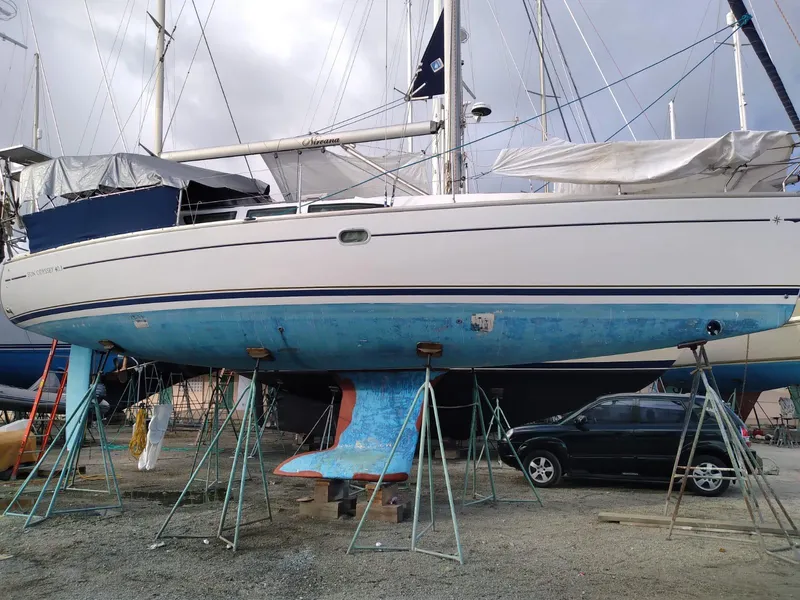 Slide: The Image of 2005 Jeanneau Sun Odyssey 40.3 sailboat on stands in dry dock. - 5
