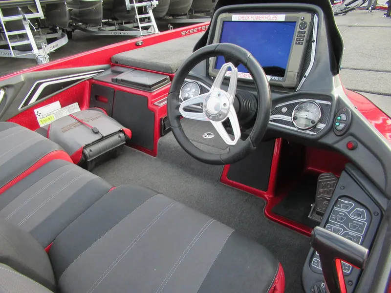 Slide: The Image of 2016 Skeeter FX 21 boat cockpit with steering wheel and control panel. - 3