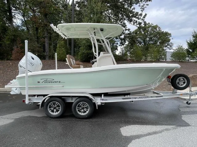 Slide: The Image of 2024 Pioneer Sportfish 202 boat on a trailer, side view. - 2