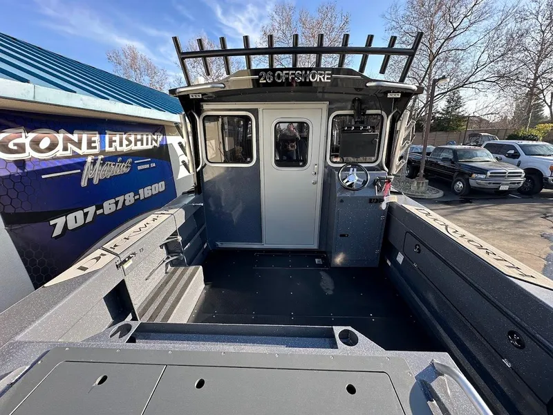 Slide: The Image of 2024 Duckworth 26 Offshore boat, spacious deck, parked at dealership. - 12